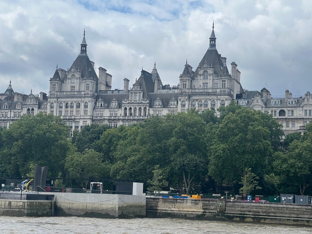       Historic building with lush green surroundings.
  
