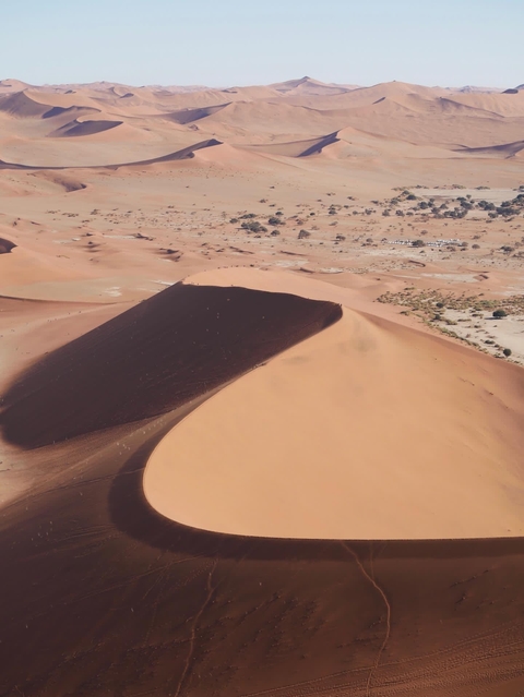       Large sand dune in a desert landscape
  