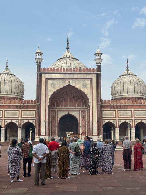       Mughal architecture with domes and intricate inlays.
  