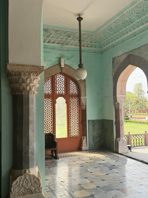       Interior with decorative columns and windows.
  
