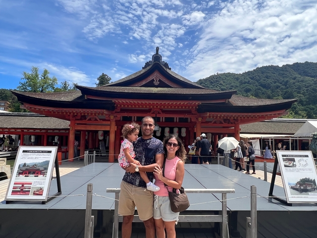 Family posing by a traditional Japanese temple.
