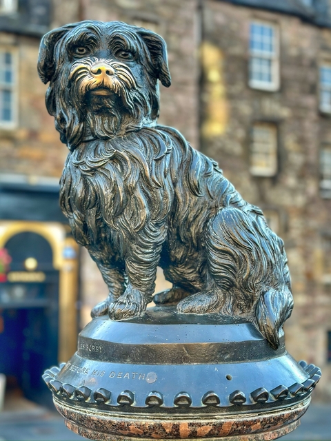       Statue of a shaggy dog sitting prominently.
  