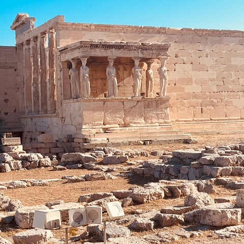       Ancient structure with female statues and stone ruins
  
