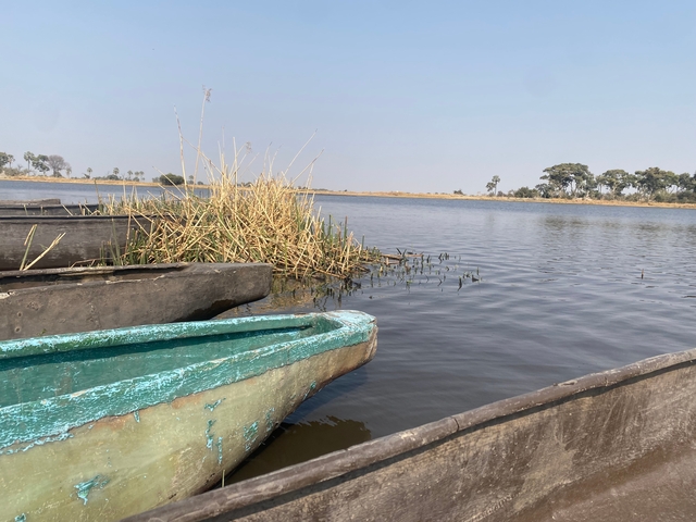 Wooden boats on a calm lake.