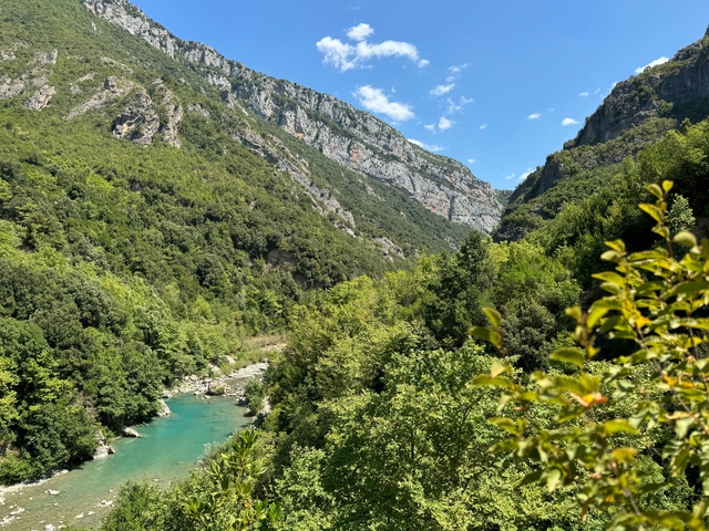 Scenic valley with a river and mountains.
