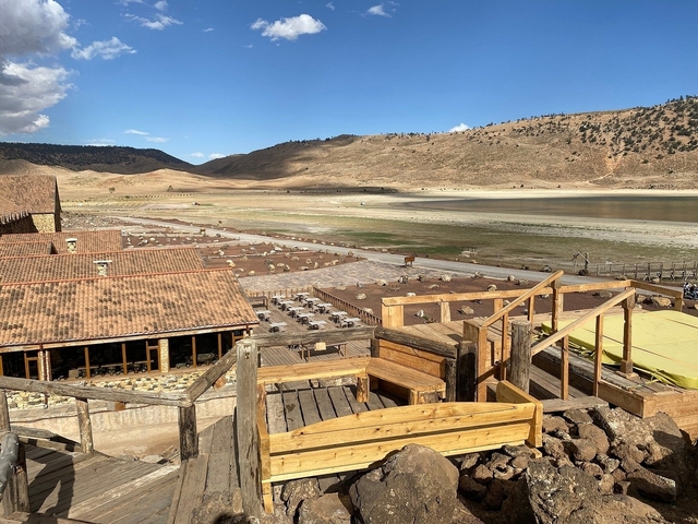       Rustic view of buildings near a dry lake
  