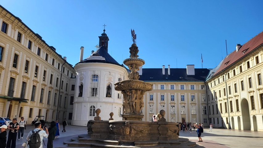 Baroque-style courtyard with a fountain.