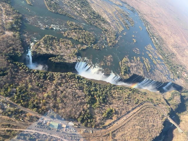 Aerial view of Victoria Falls with a rainbow.