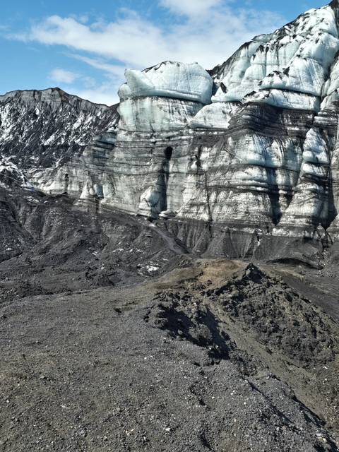 Rocky landscape with large icy formations.