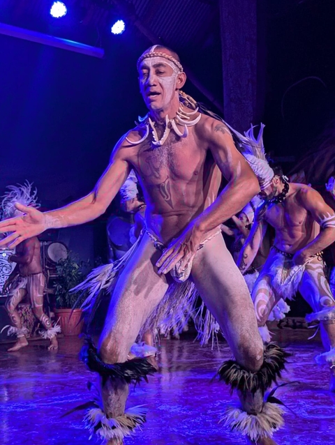 Traditional dance performance with performers in costume.