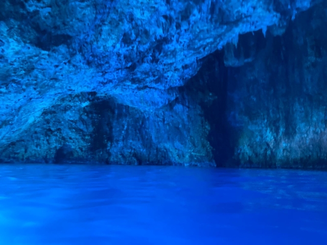 Inner view of a cave with blue lighting.