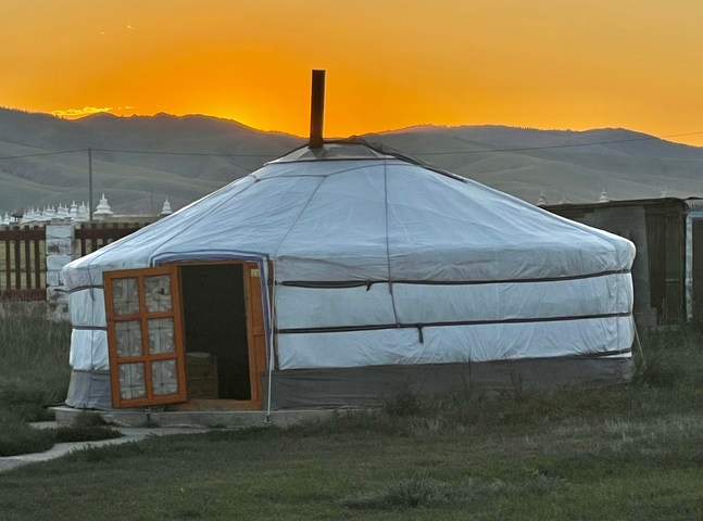       Traditional Mongolian yurt at sunset.
  