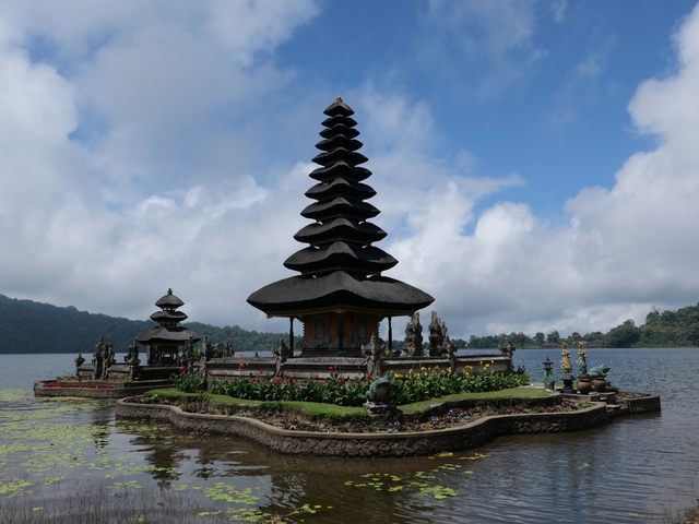       A traditional Balinese temple on water.
  