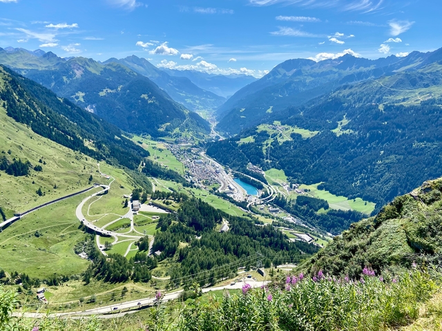 Panoramic mountain view with a village nestled in the valley.