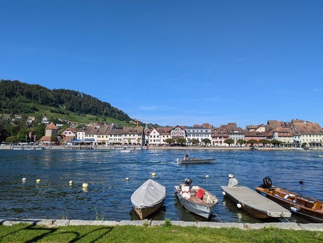 A picturesque lakeside town with boats on the water.