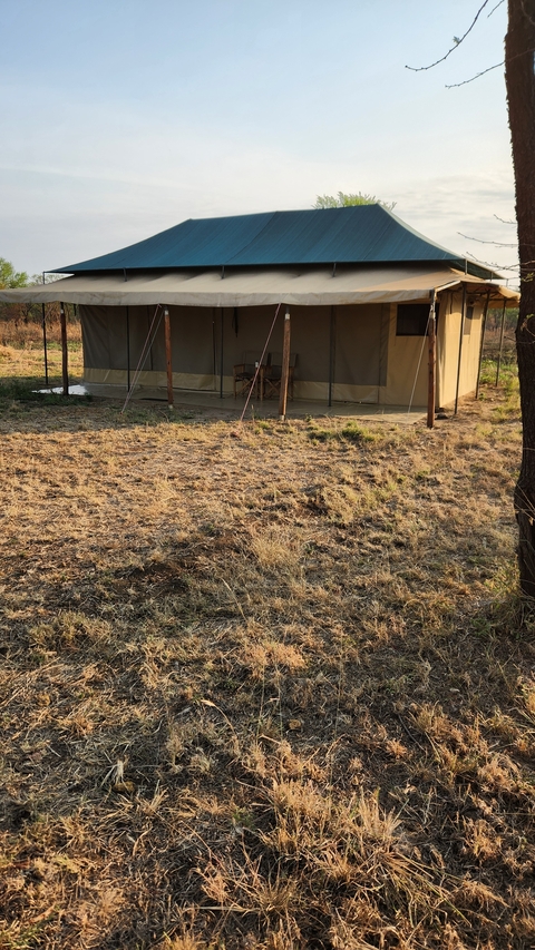 Outdoor tent in a rural area.