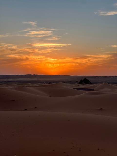      Beautiful desert view with sand dunes at sunset.
  