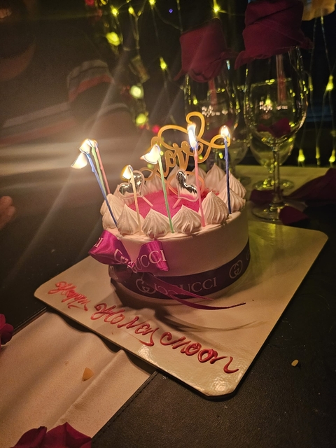       Decorated cake with candles.
  