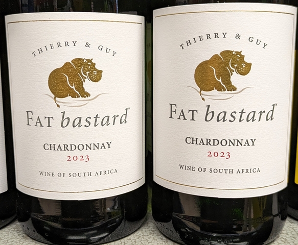       Close-up of two wine bottles with labels clearly visible.
  