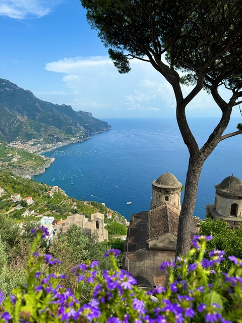 Scenic coastal view with cliffs and villages.