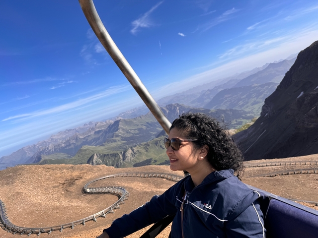       Person looking out over mountainous landscape.
  