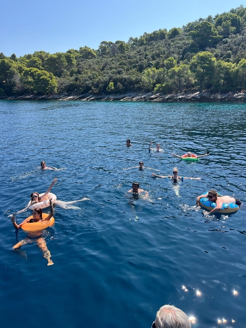 People swimming and floating in the sea.
