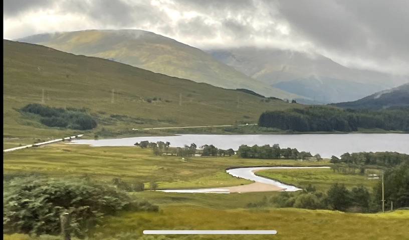 Open landscape with mountains and a winding river.