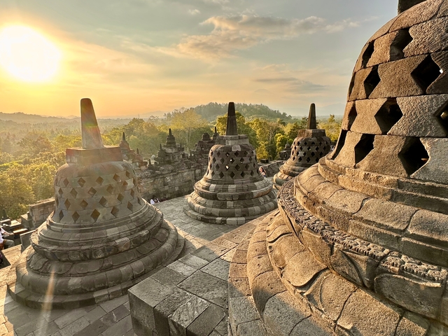 Ancient temple structures during sunrise.