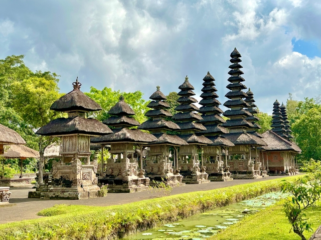 Temple with pagoda-style roofs surrounded by greenery.