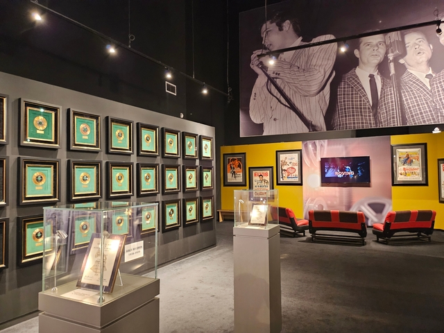 Room showcasing music awards and memorabilia.