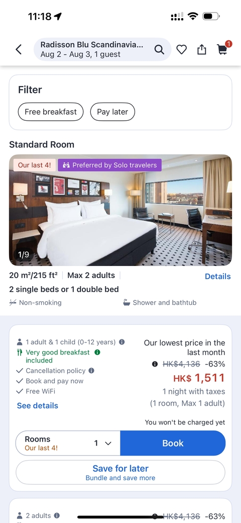 Interior image showing a hotel room with double beds.