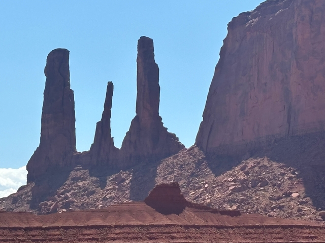 Dramatic rock formations in a desert landscape.