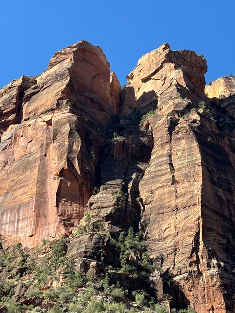 Colorful and towering rock formations in a desert-like environment.