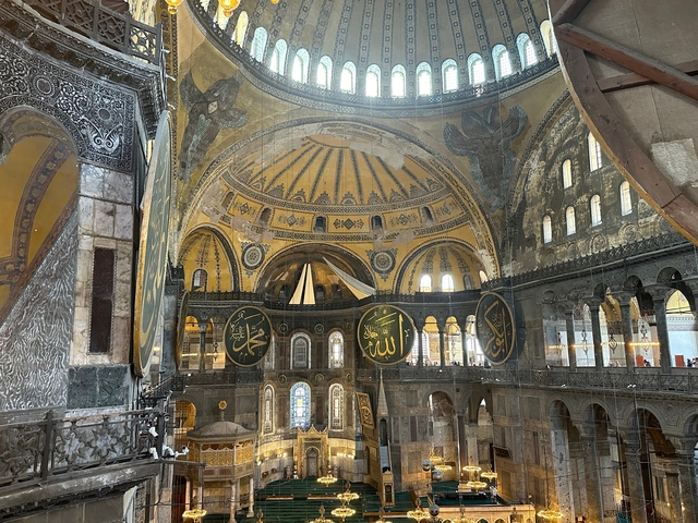 Interior view of a grand historic building with intricate architecture.