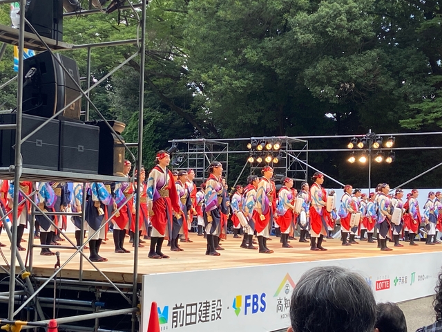 Large group of performers on stage.