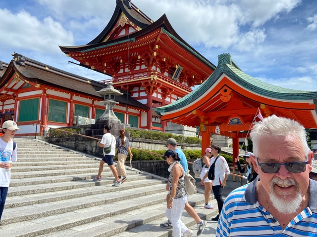Traditional Japanese shrine with people.