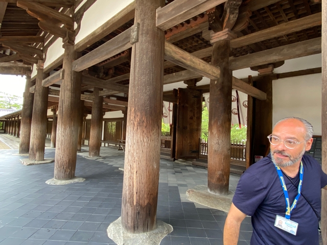 Traditional wooden structure with person.