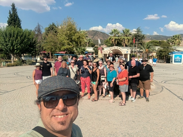A group of people posing for a photo in a courtyard.