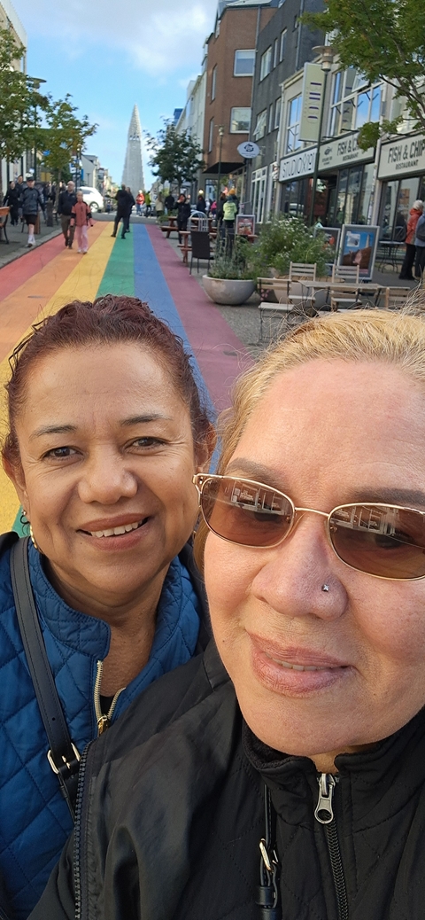       Close-up of two women posing for a selfie.
  