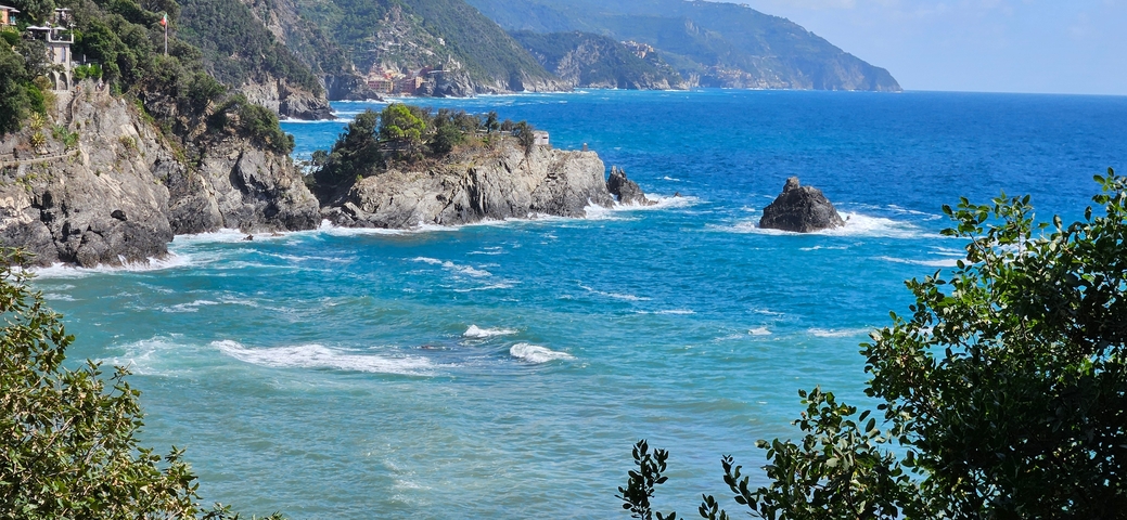 Coastal landscape view with sea and rocky cliffs.