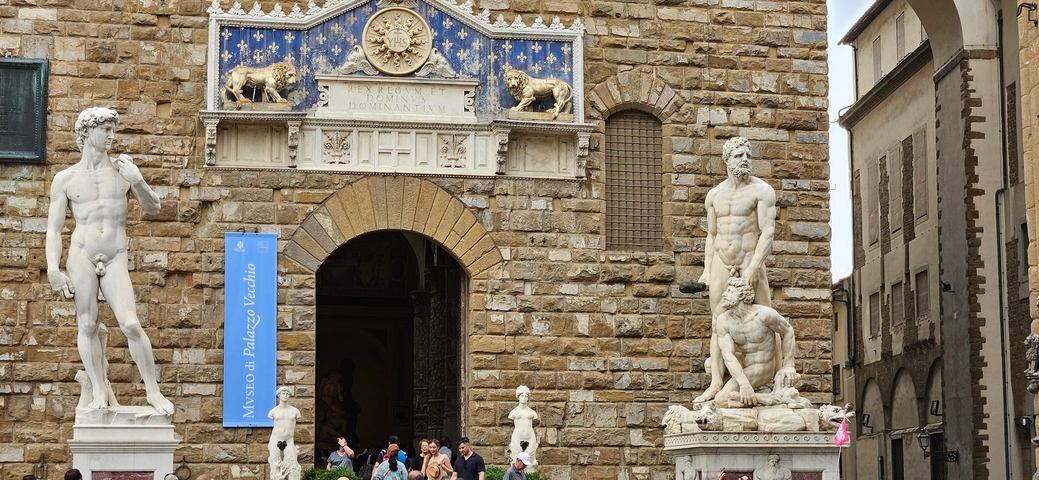 Close-up view of statues in front of a historic building.