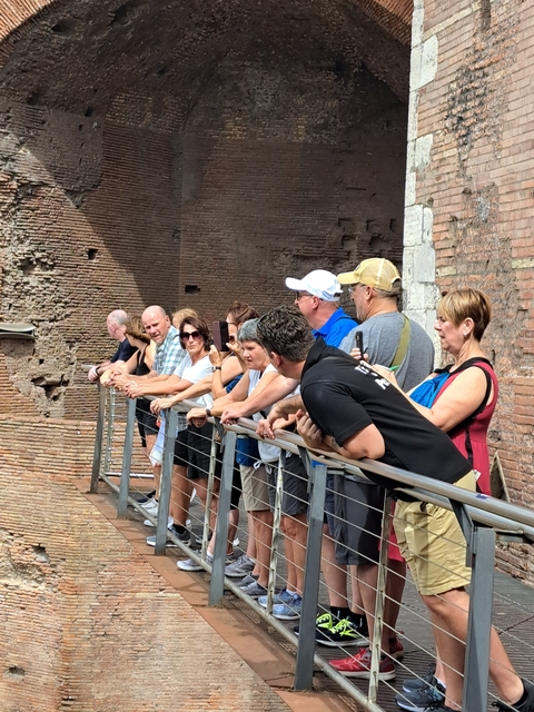 Tourists observing ancient ruins.