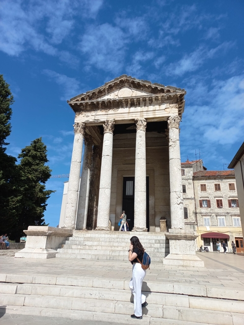 An ancient Roman temple with columns.