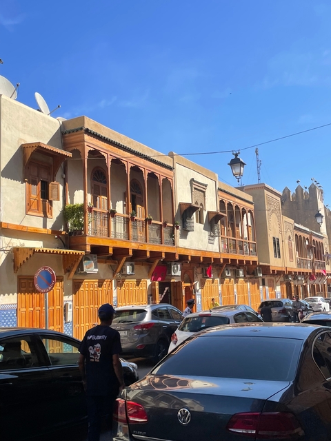 Traditional Moroccan buildings with wooden balconies.