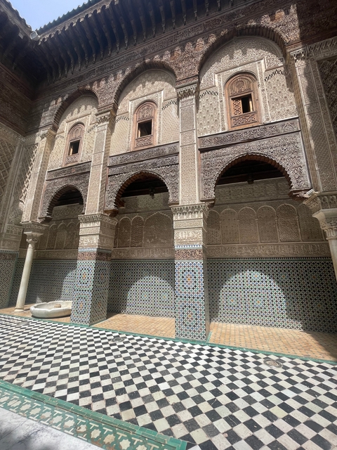 Intricate Moroccan architecture with arches and detailed tiles.