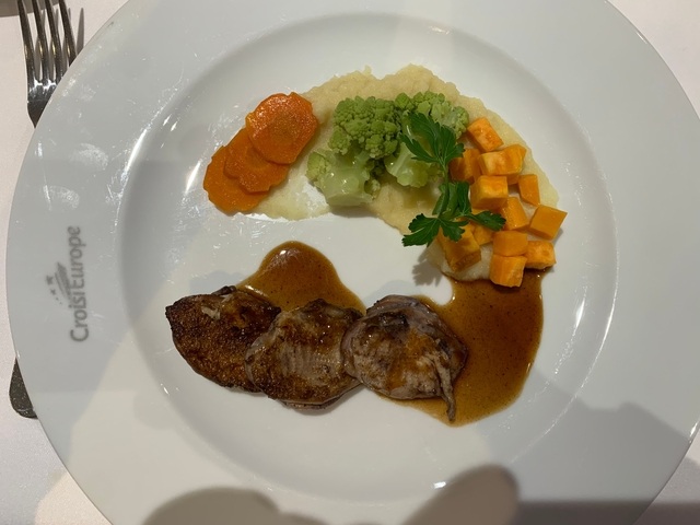 Gourmet dish with meat and vegetables.