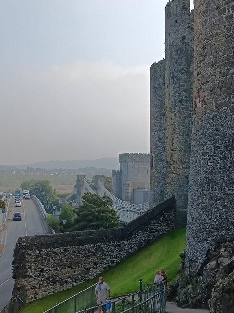 Suspension bridge near castle walls.