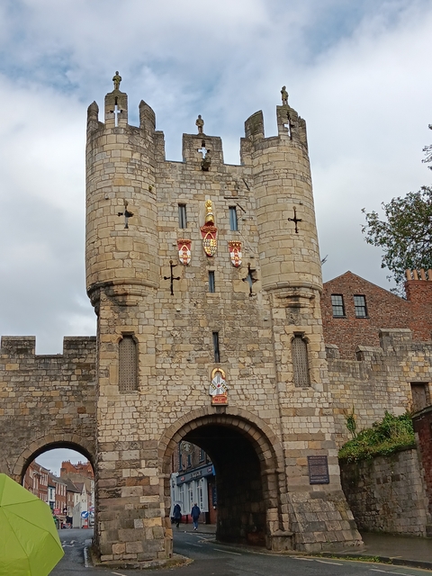 Medieval gate with coats of arms.