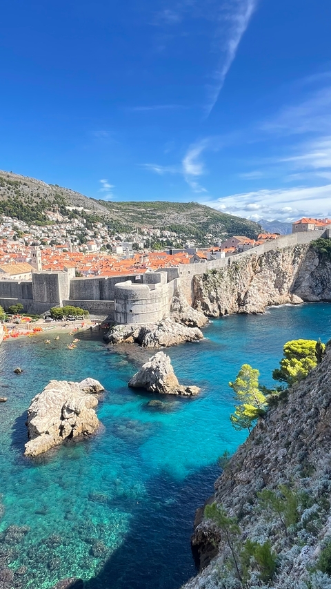 Stunning view of Dubrovnik's historic city walls and coastline.