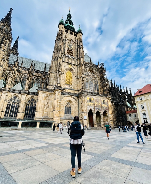 Tourists in front of St. Vitus Cathedral in Prague.